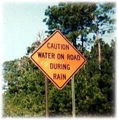 CAUTION WATER ON ROAD DURING RAIN