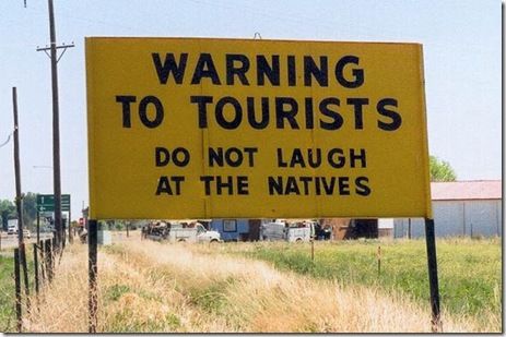 WARNING TO TOURISTS
 DO NOT LAUGH AT THE NATIVES