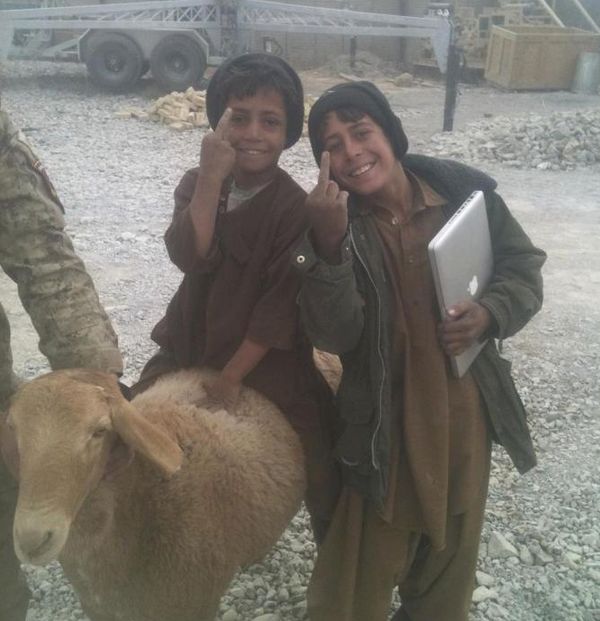 gypsy kids with a macbook