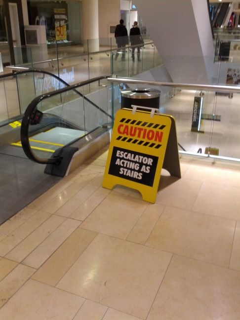 CAUTION
 ESCALATOR ACTING AS STAIRS