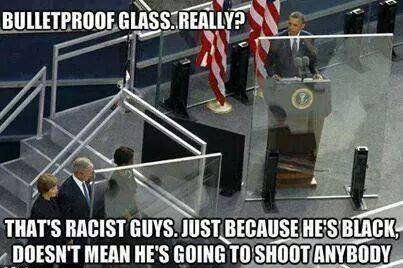 BULLETPROOF GLASS. REALLY? THAT'S RACIST GUYS. JUST BECAUSE HE'S BLACK, DOESN'T MEAN HE'S GOING TO SHOOT ANYBODY